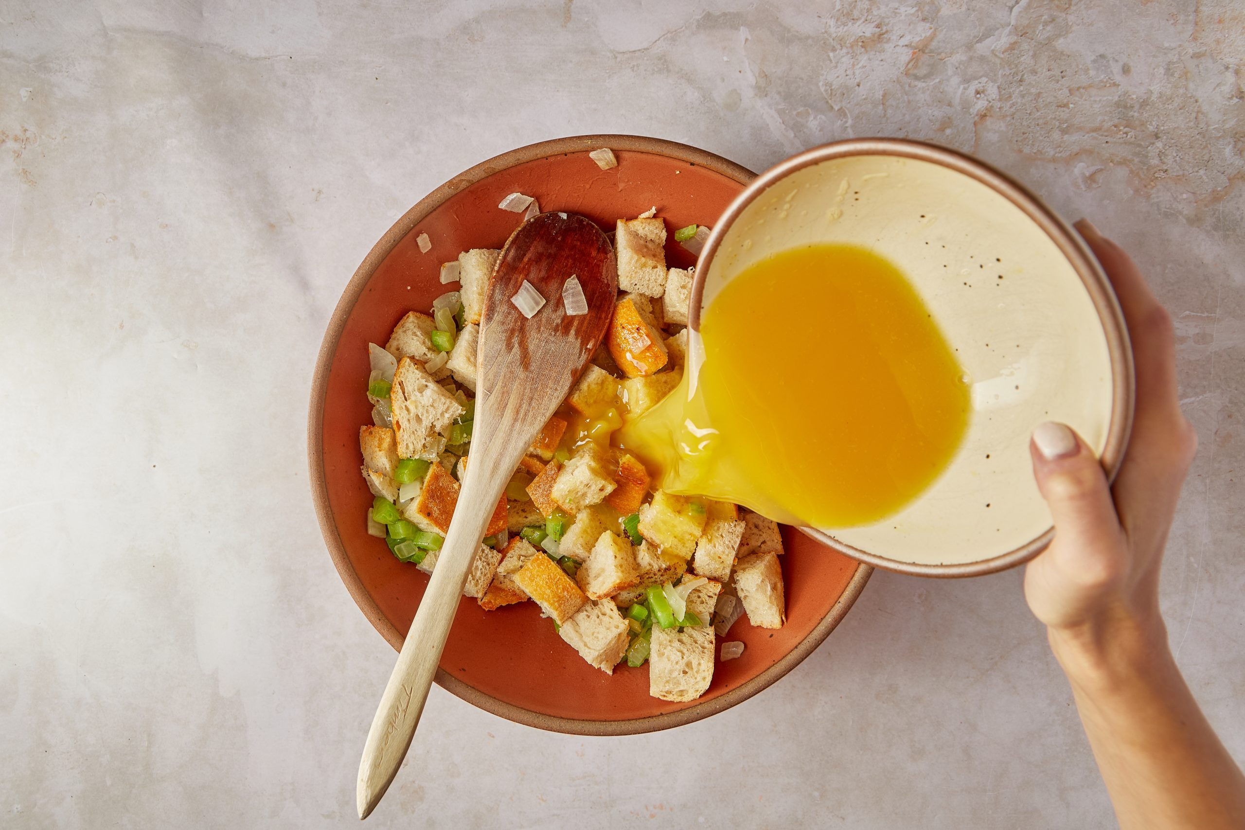 Mix the ingredients for the vegetarian crockpot stuffing.