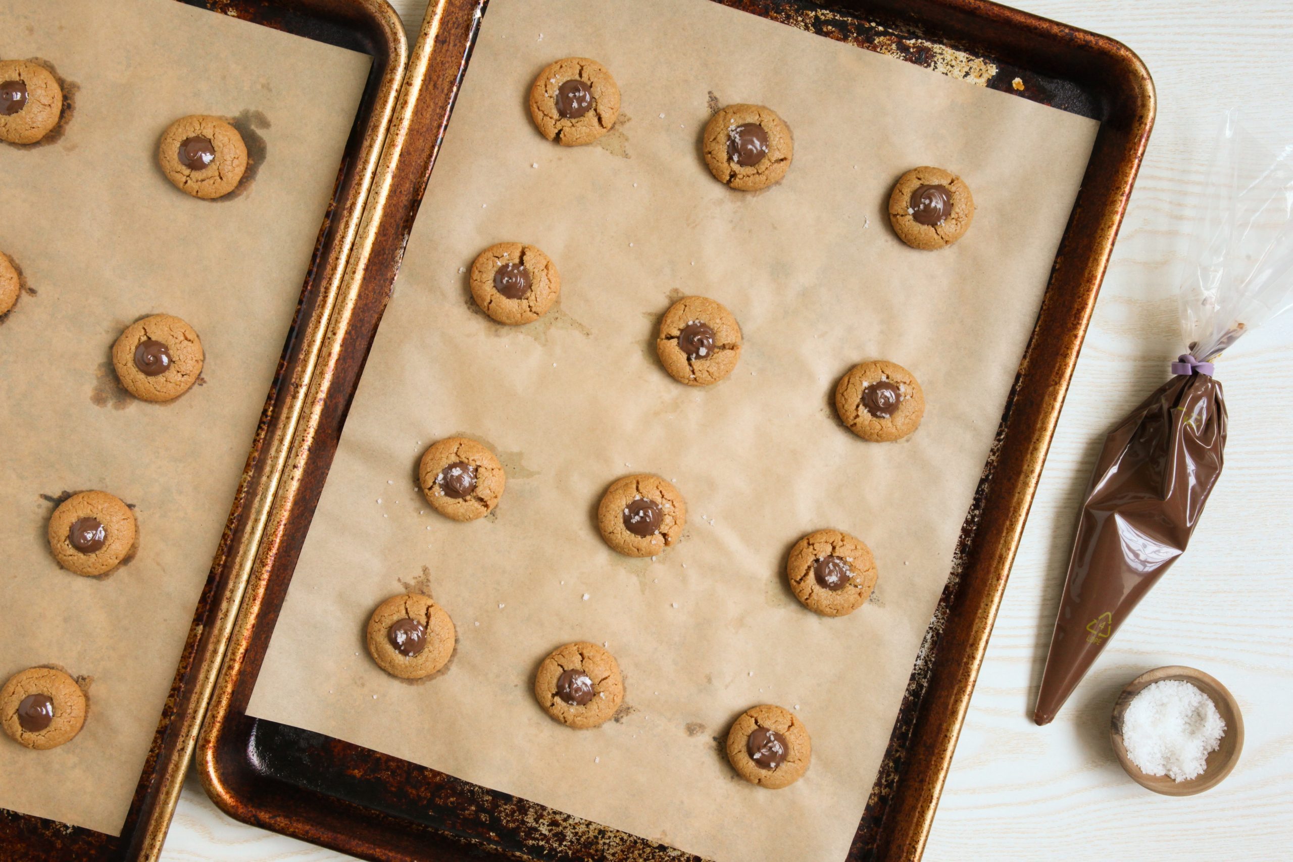 Filling peanut butter thumbprint cookies with Nutella