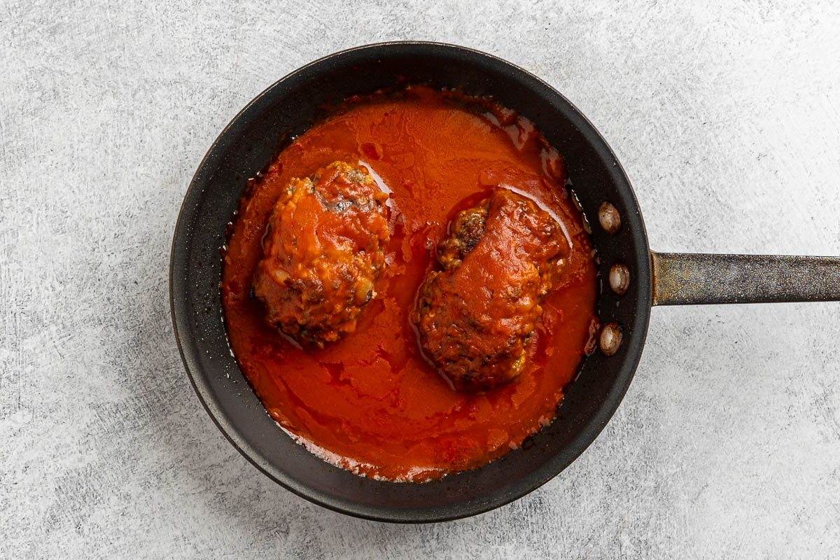 Taste of Home Skillet Meatloaf recipe photo of the loaves with the prepared sauce added to the skillet.