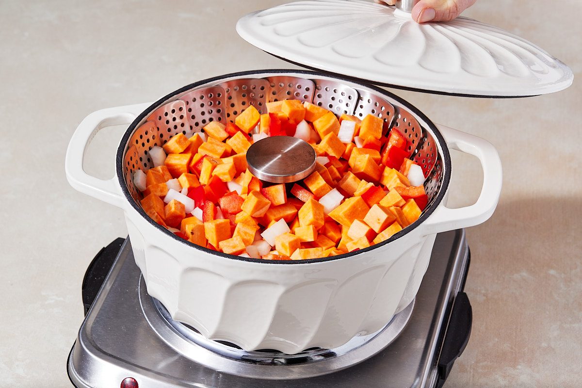 Smoky Sweet Potato And Black Bean Enchiladas Step 1- Steaming vegetables