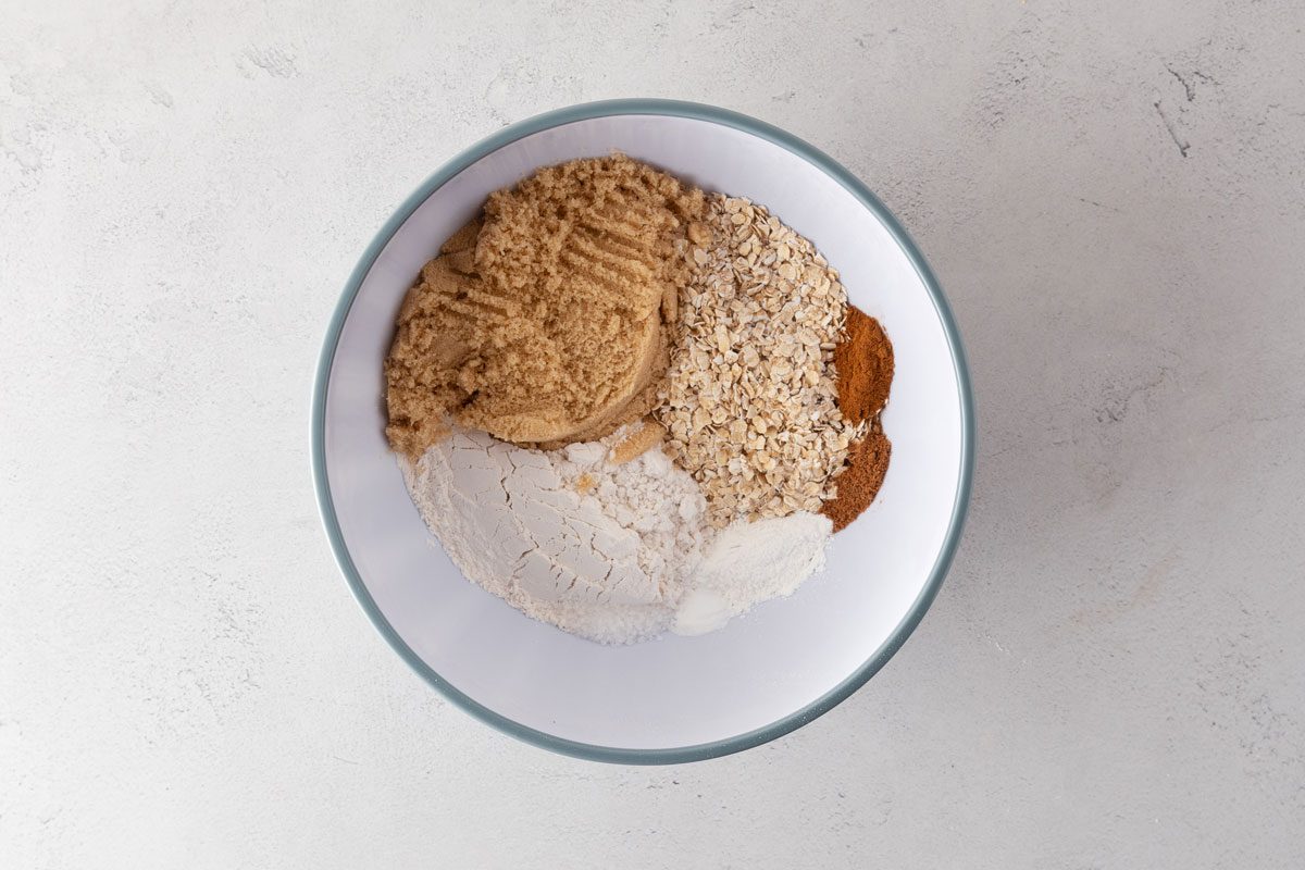 Soft Blueberry Oatmeal Muffins dry ingredients in a mixing bowl.