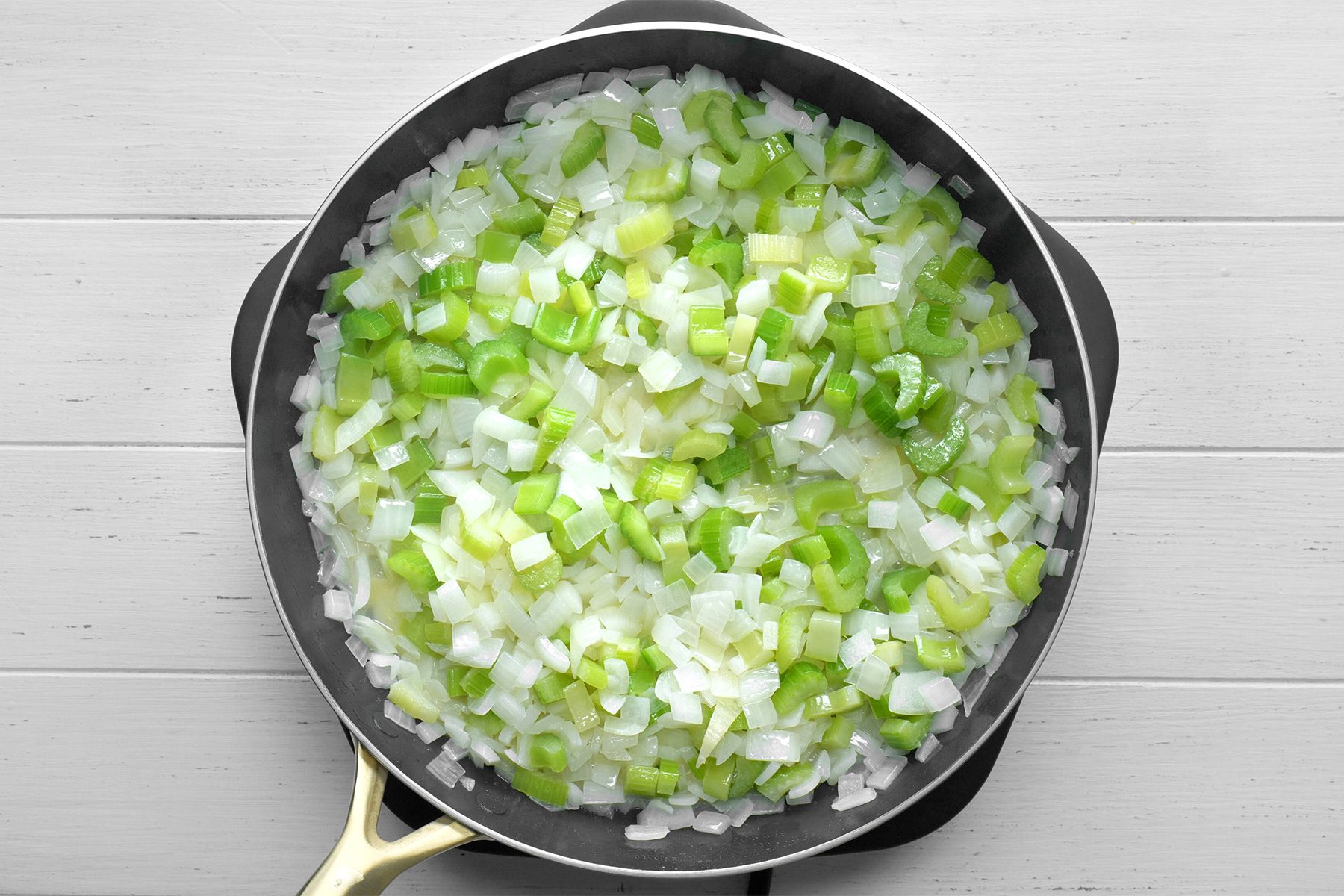 In a large skillet, saute onions and celery in butter until tender