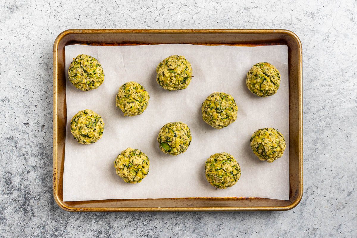Taste of Home Zucchini Meatballs recipe photo of the baked zucchini meatballs on a baking sheet.