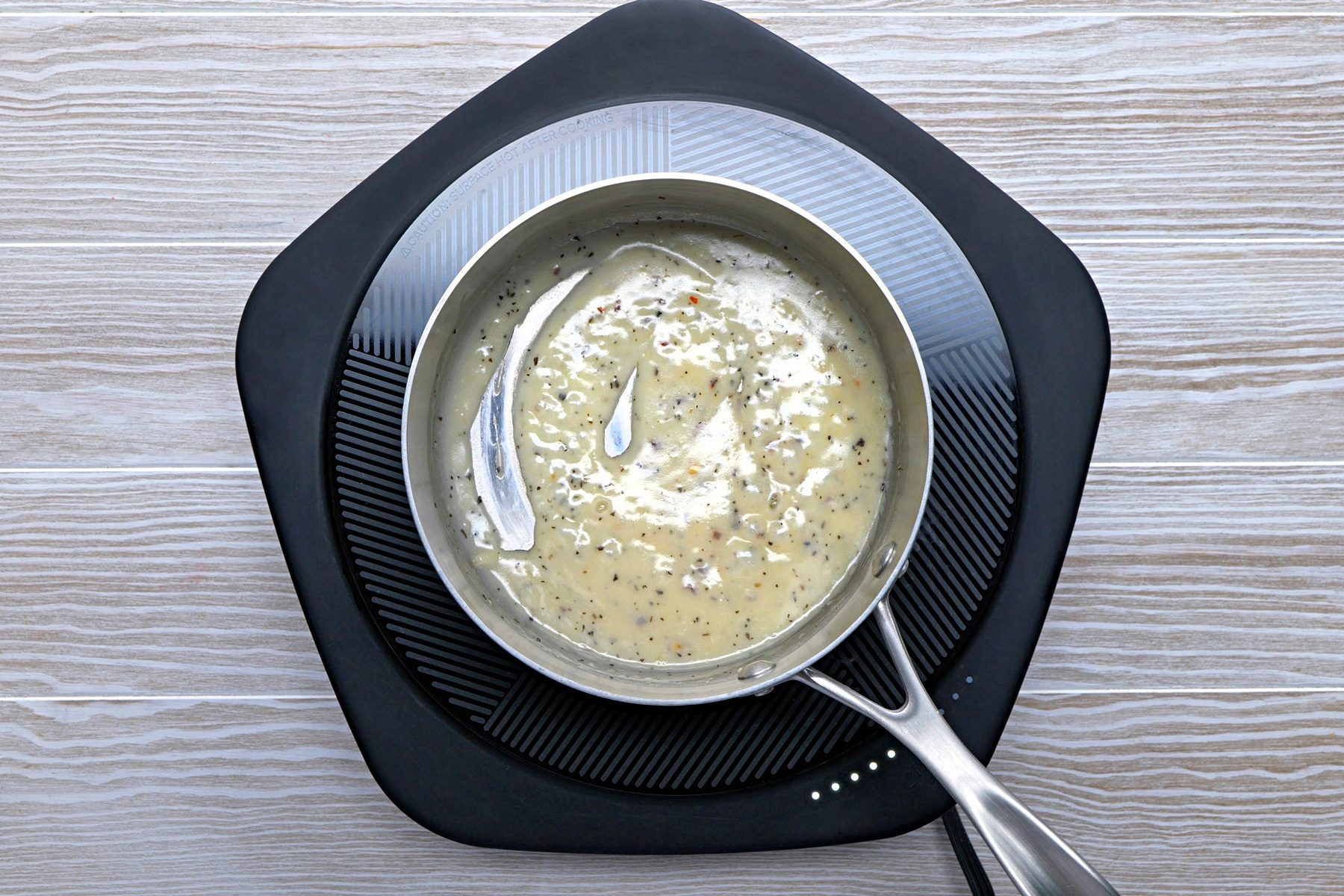 Meanwhile, in a small saucepan, melt butter. Stir in the oil, flour, garlic and seasonings until blended.