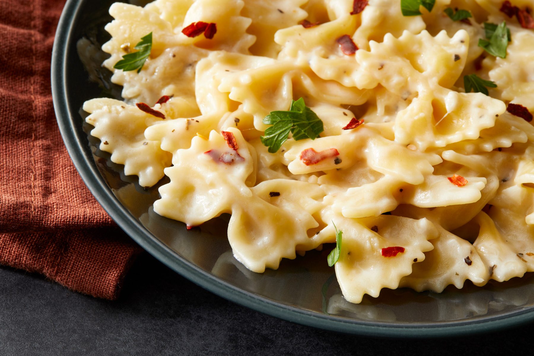 Close up shot of bow tie pasta in black bowl