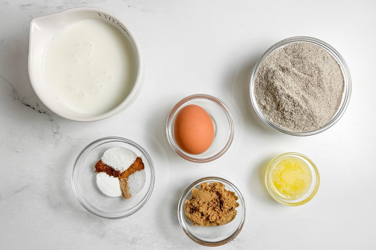 Ingredients for Taste of Home Buckwheat Pancakes in glass and ceramic bowls