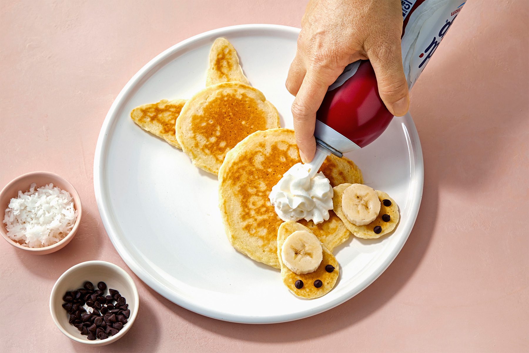 Dollop whipped cream on body just above the feet