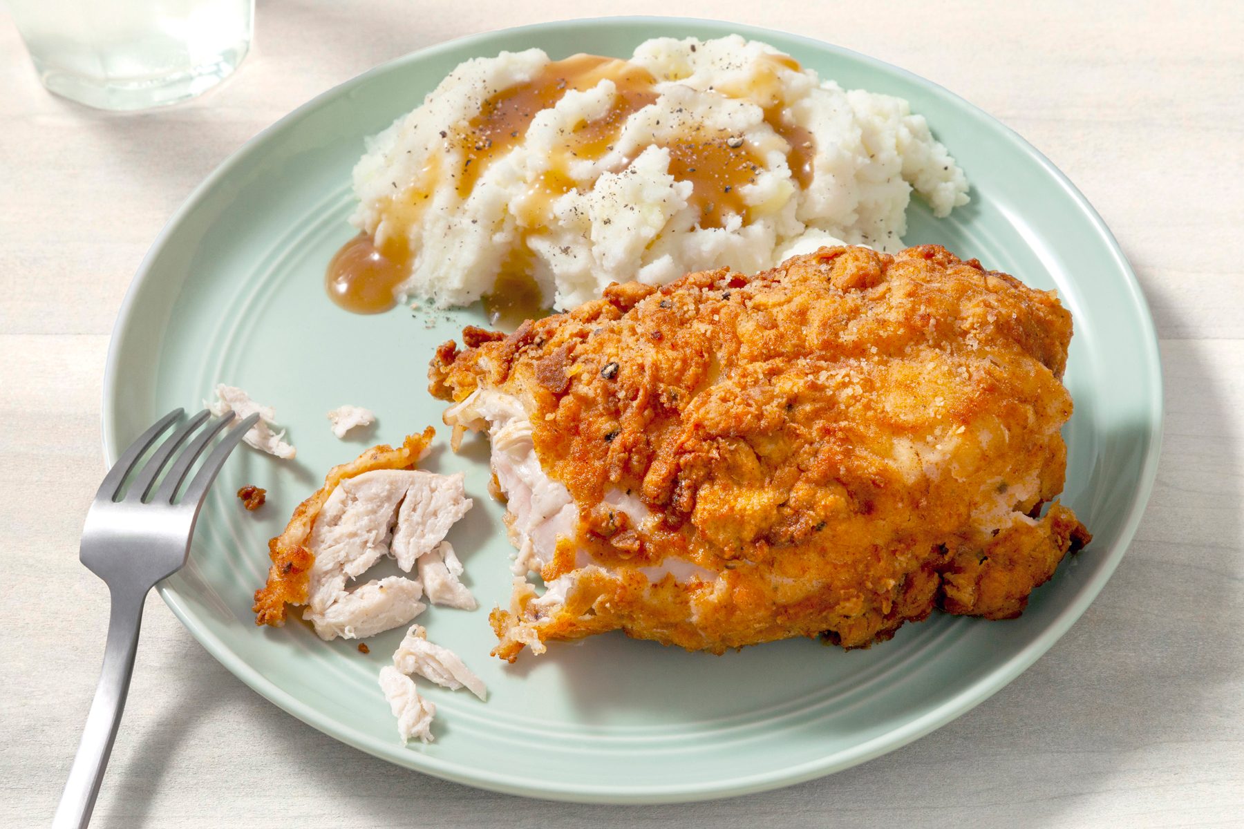 Buttermilk Fried Chicken on plate with fork