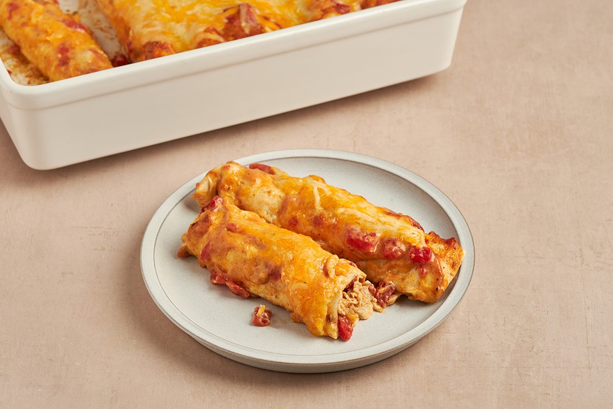 Find comfort and deliciousness in these easy-to-make chicken enchiladas with cream of chicken soup by Taste of Home.