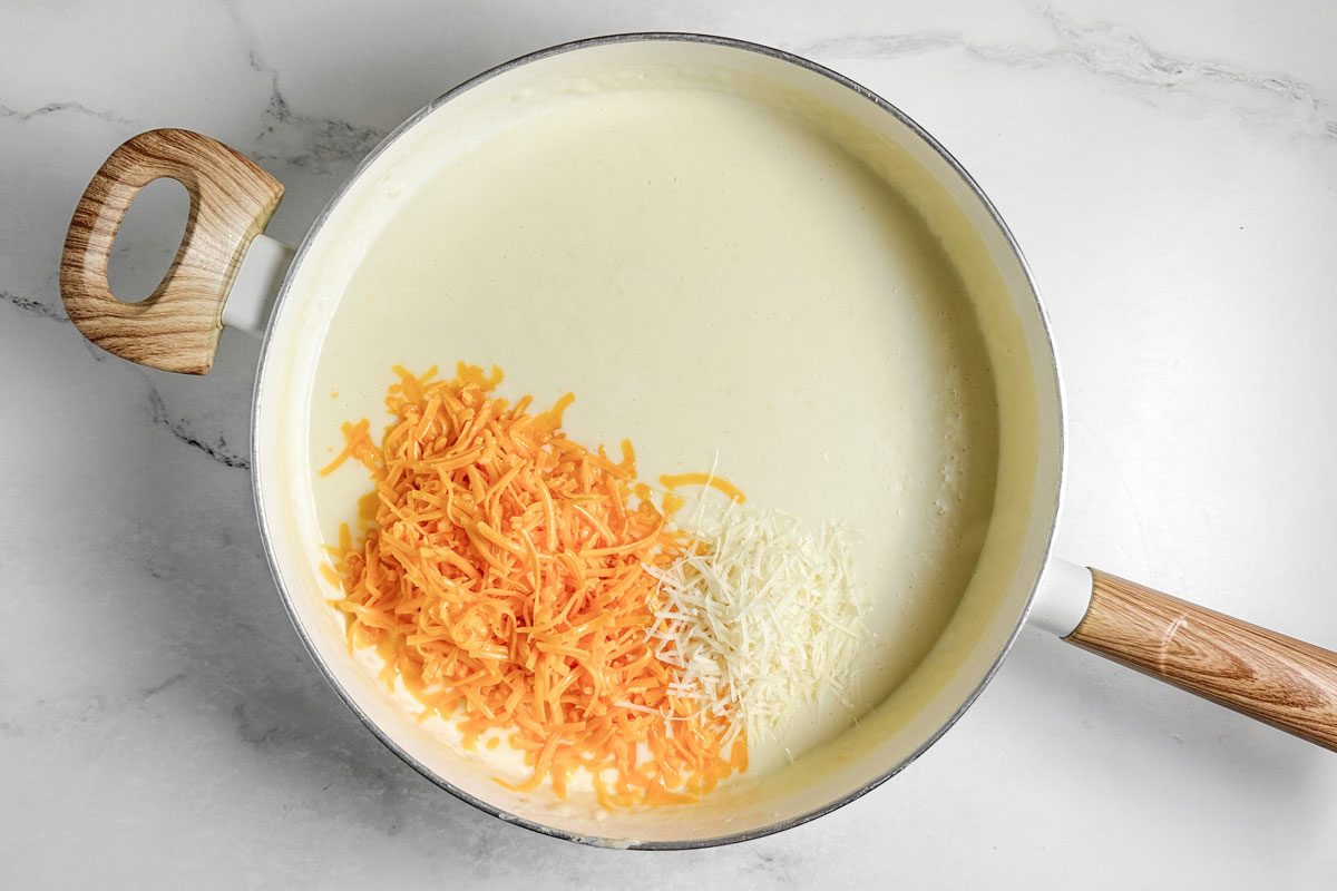 Sauce ingredients for Taste of Home Chicken Manicotti in a white skillet