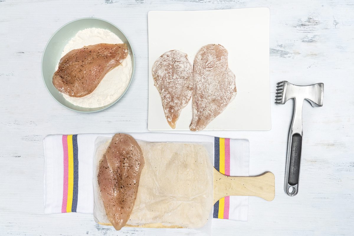 Chicken Piccata dipping in flour