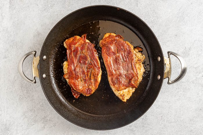 Taste of Home Chicken Saltimbocca photo of the cooked chicken in a skillet.