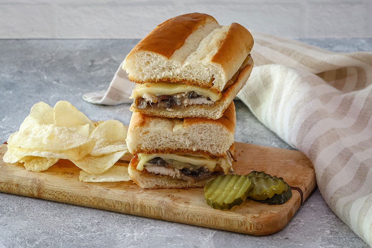 Cheesy chicken subs with mushrooms, Swiss cheese, and red onions.