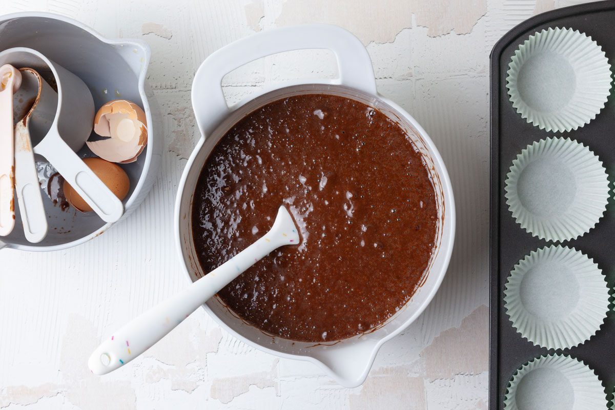 Step 1 of Taste of Home Chocolate Peanut Butter Cupcakes is to combine the sugar, flour, cocoa, salt, baking soda and baking powder. In a separate bowl, whisk the buttermilk, coffee, oil, eggs and vanilla until blended. Add the wet ingredients to the dry ingredients until combined