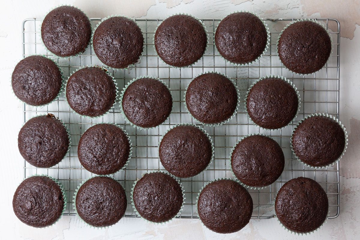 Step 2 of Taste of Home Chocolate Peanut Butter Cupcakes is to bake the cupcakes for 18 to 20 minutes or until a toothpick inserted in the center comes out clean. Let them cool in the pan for 10 minutes before removing them to wire racks to cool completely.
