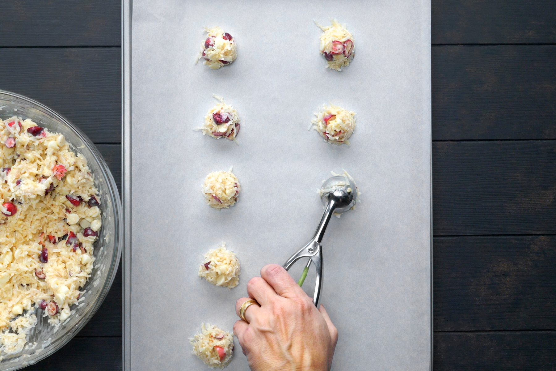 top view shot of cookie batter scooped on parchment paper