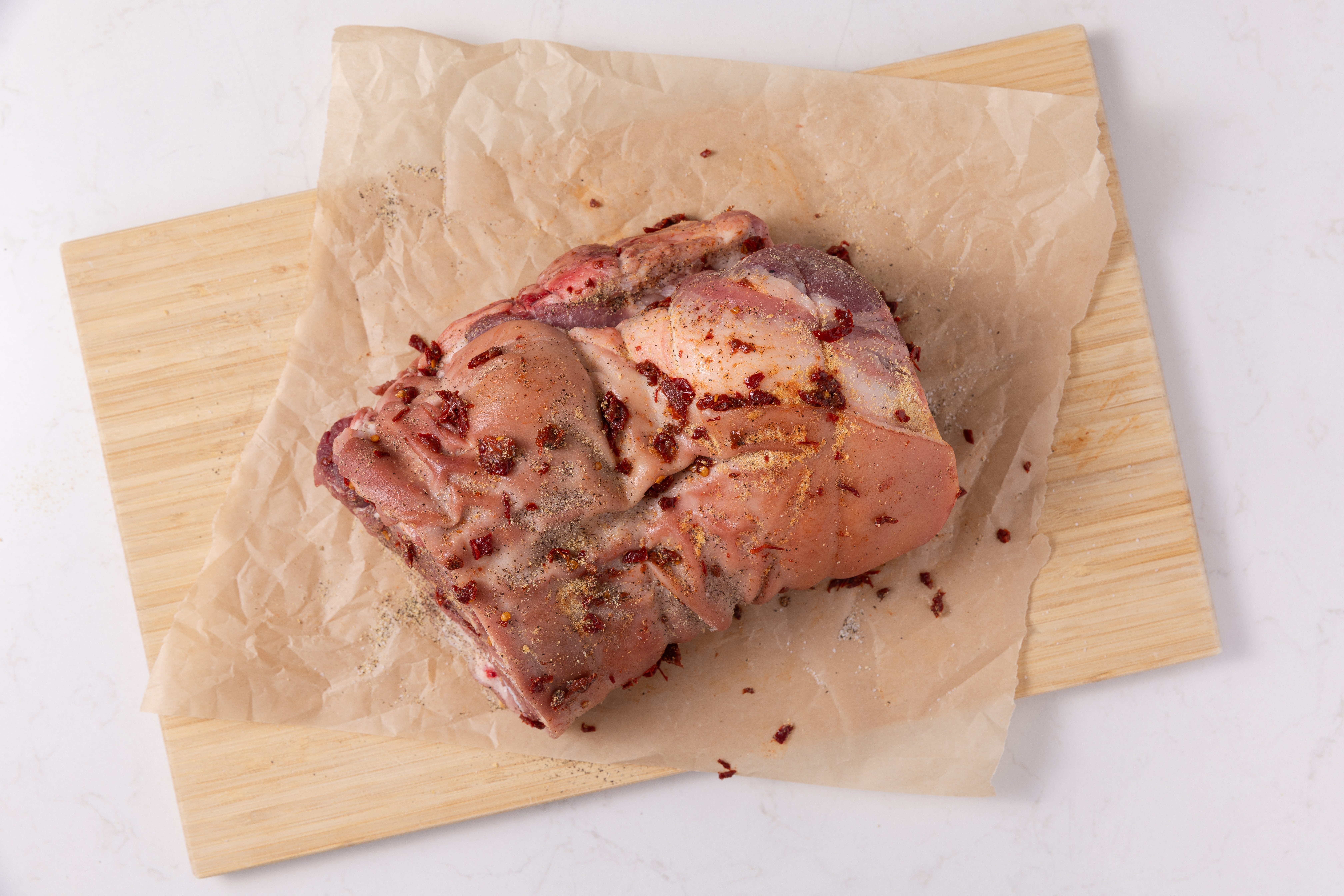 Pulled pork sprinkled with seasonings.