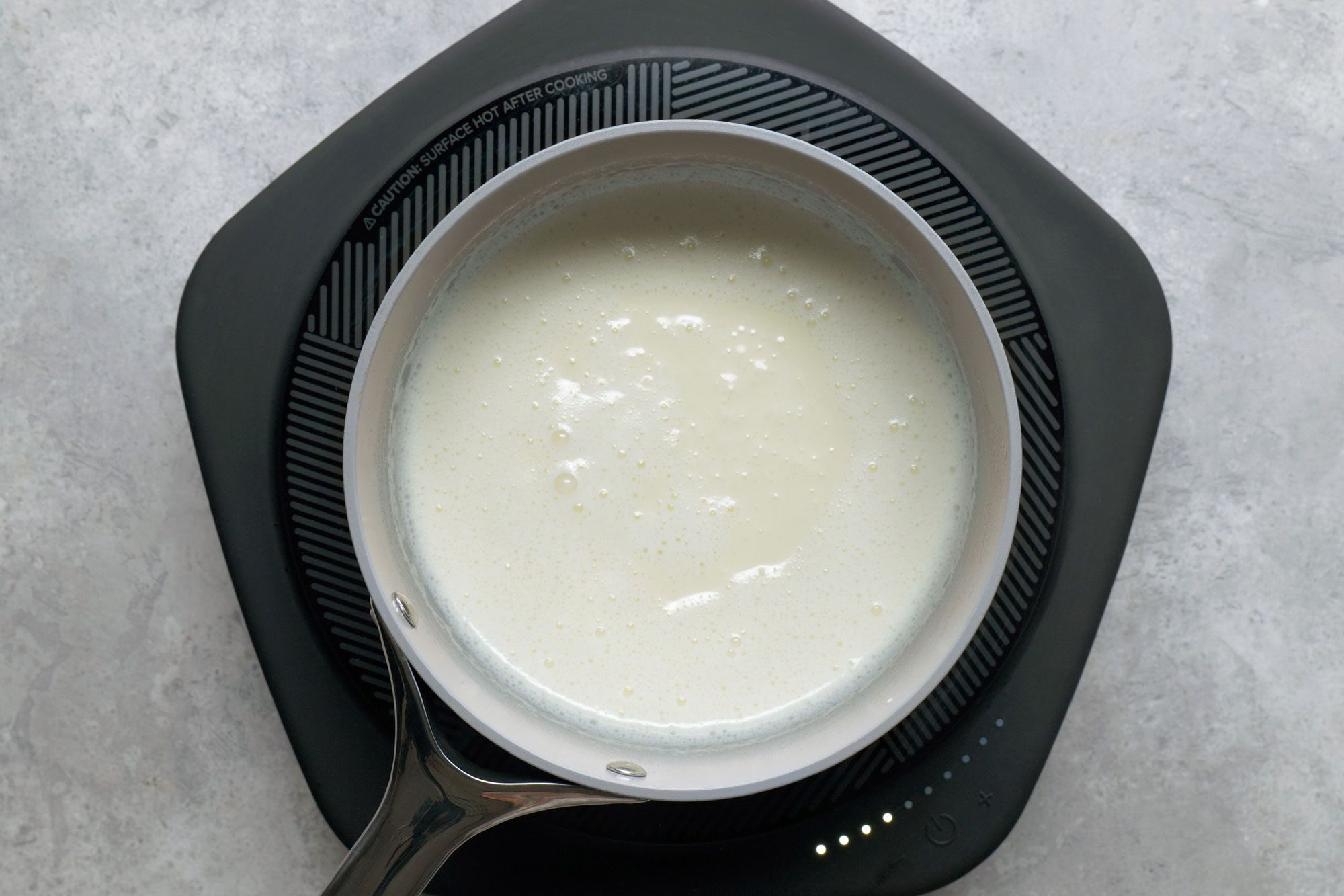 Cream in a large saucepan