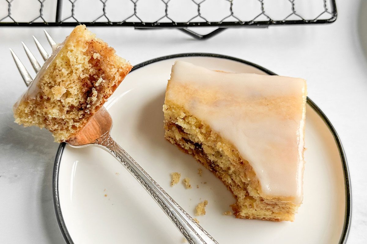 Taste of Home Honey Bun Cake on a ceramic plate