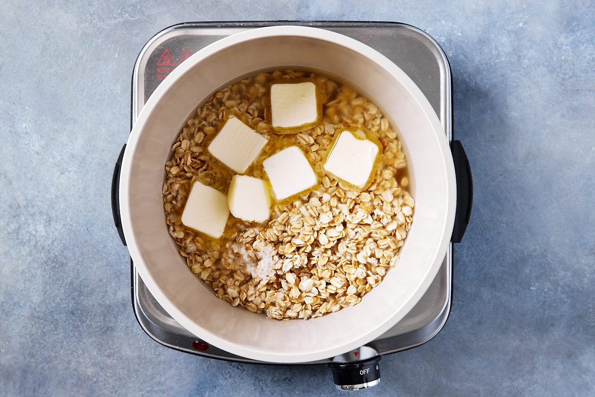 Honey Oat Bread Step 1- butter, oats and honey in boiled water