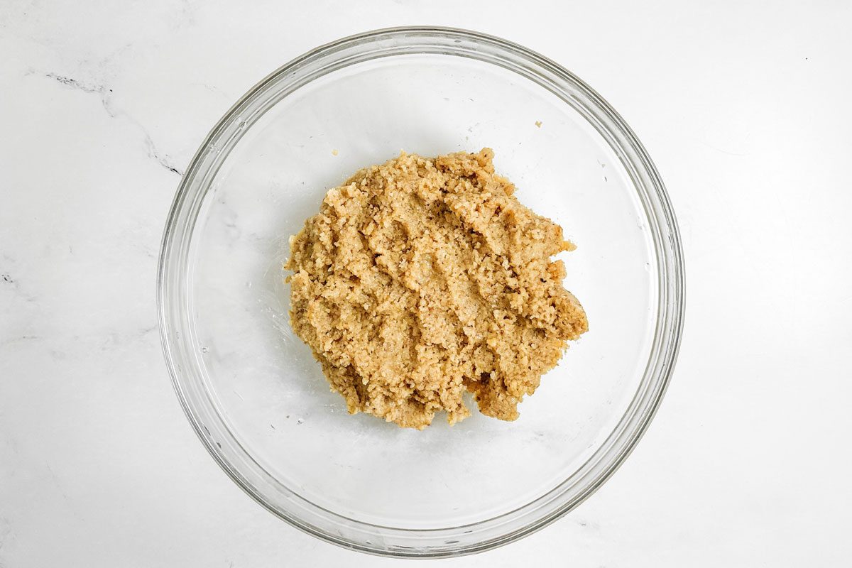 Filling for Taste of Home Kolacky Cookies in a glass bowl on a marble surface