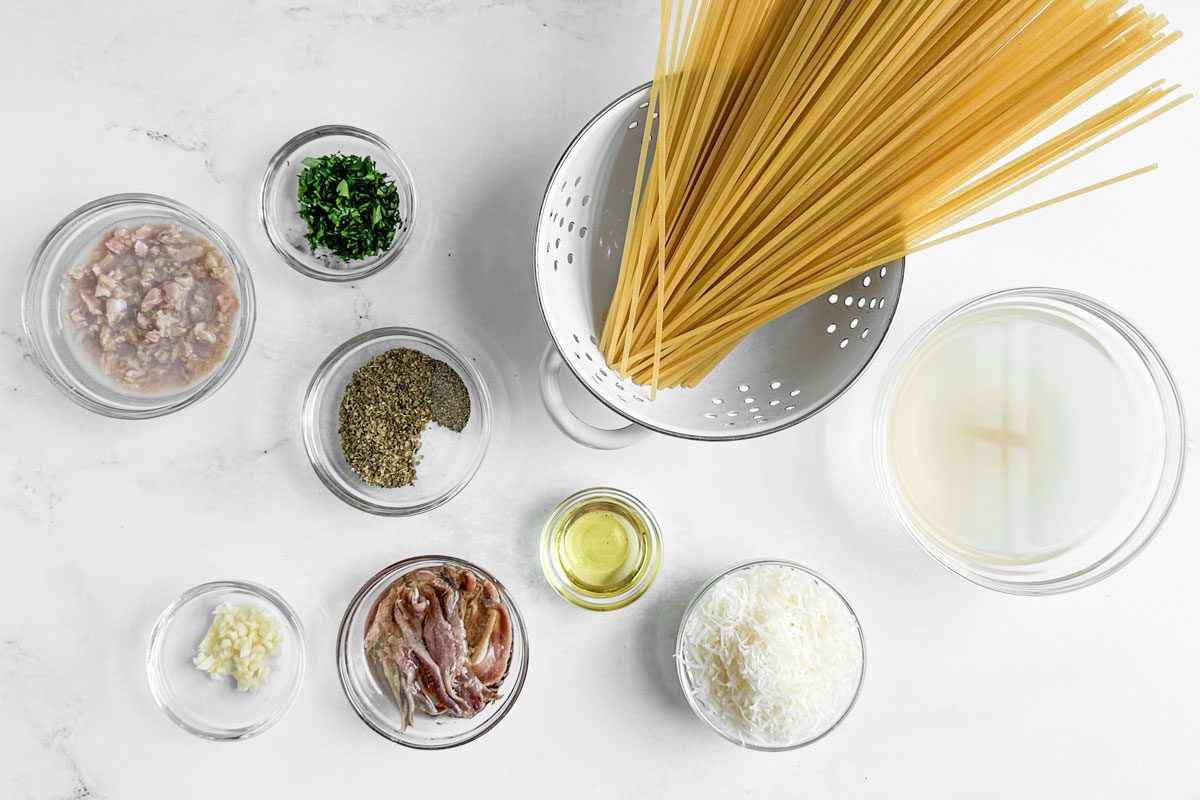 Ingredients for Taste of Home Linguine with Clam Sauce on a marble surface