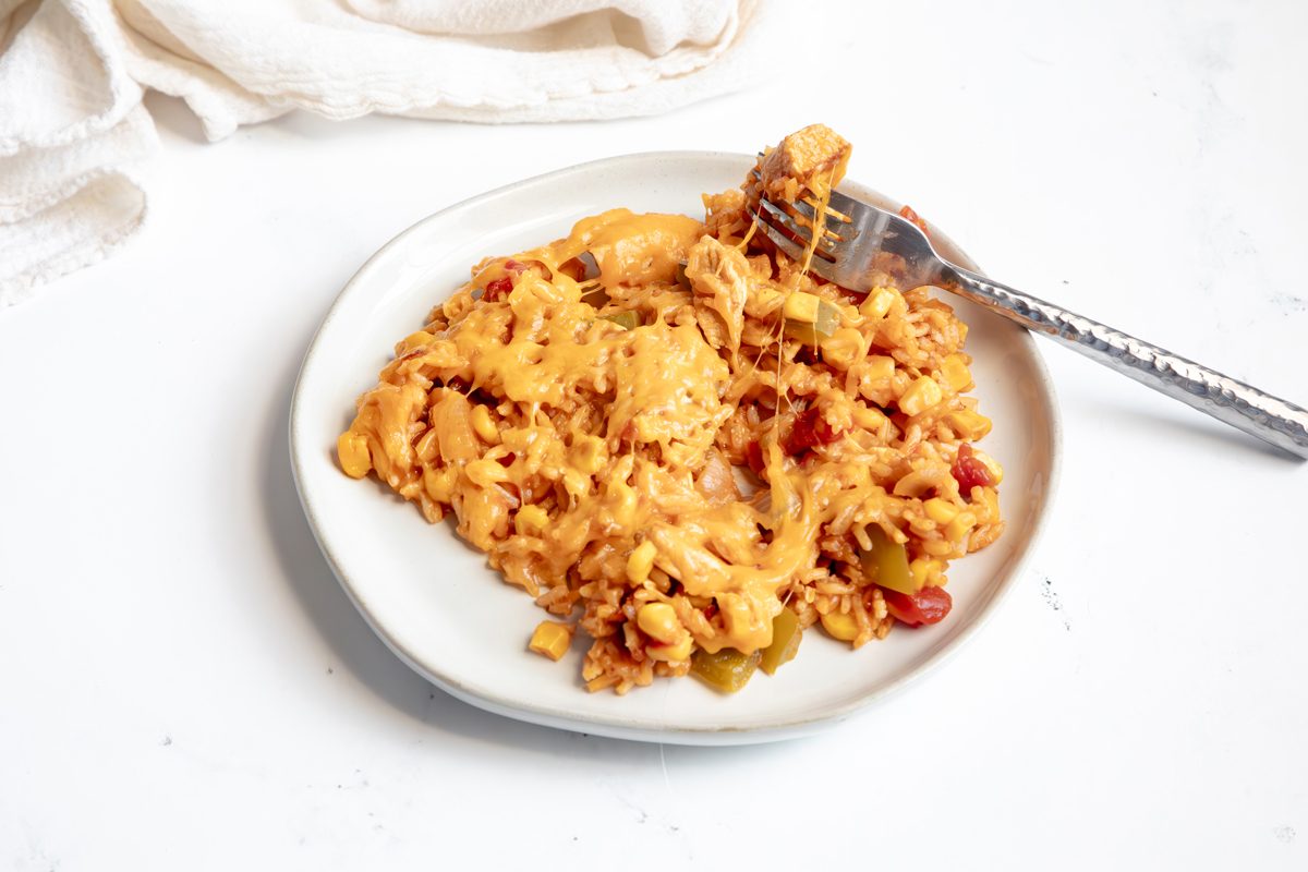 Beauty shot for Taste of Home Mexican Chicken and Rice showing cheese pull on plate.