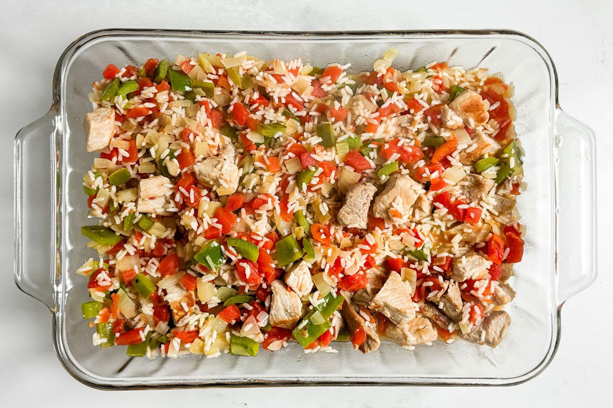 Unbaked Taste of Home Pork and Rice in a glass baking dish