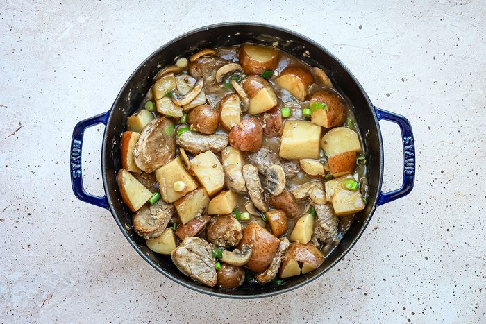 Pork and potatoes in a large skillet, a recipe from Taste of Home.