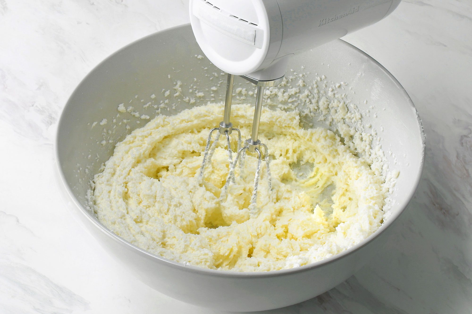In a large bowl, cream butter and sugar beating until light and fluffy, using electric beater