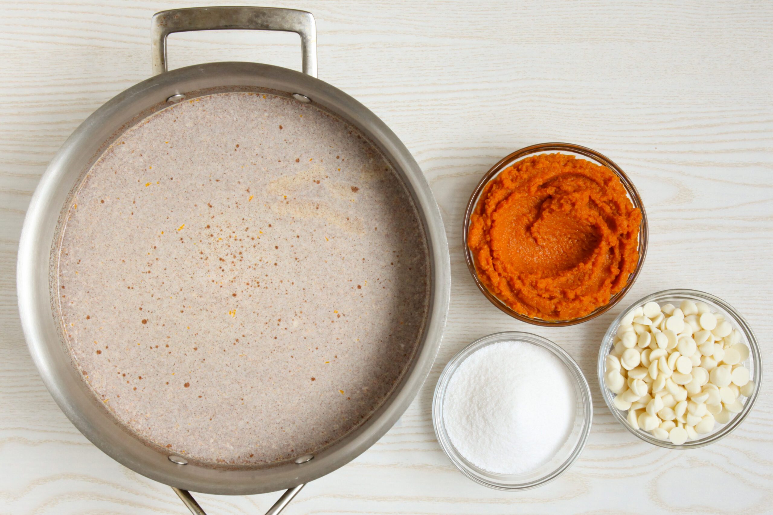 Adding pumpkin, white chocolate, and sugar to hot chocolate base