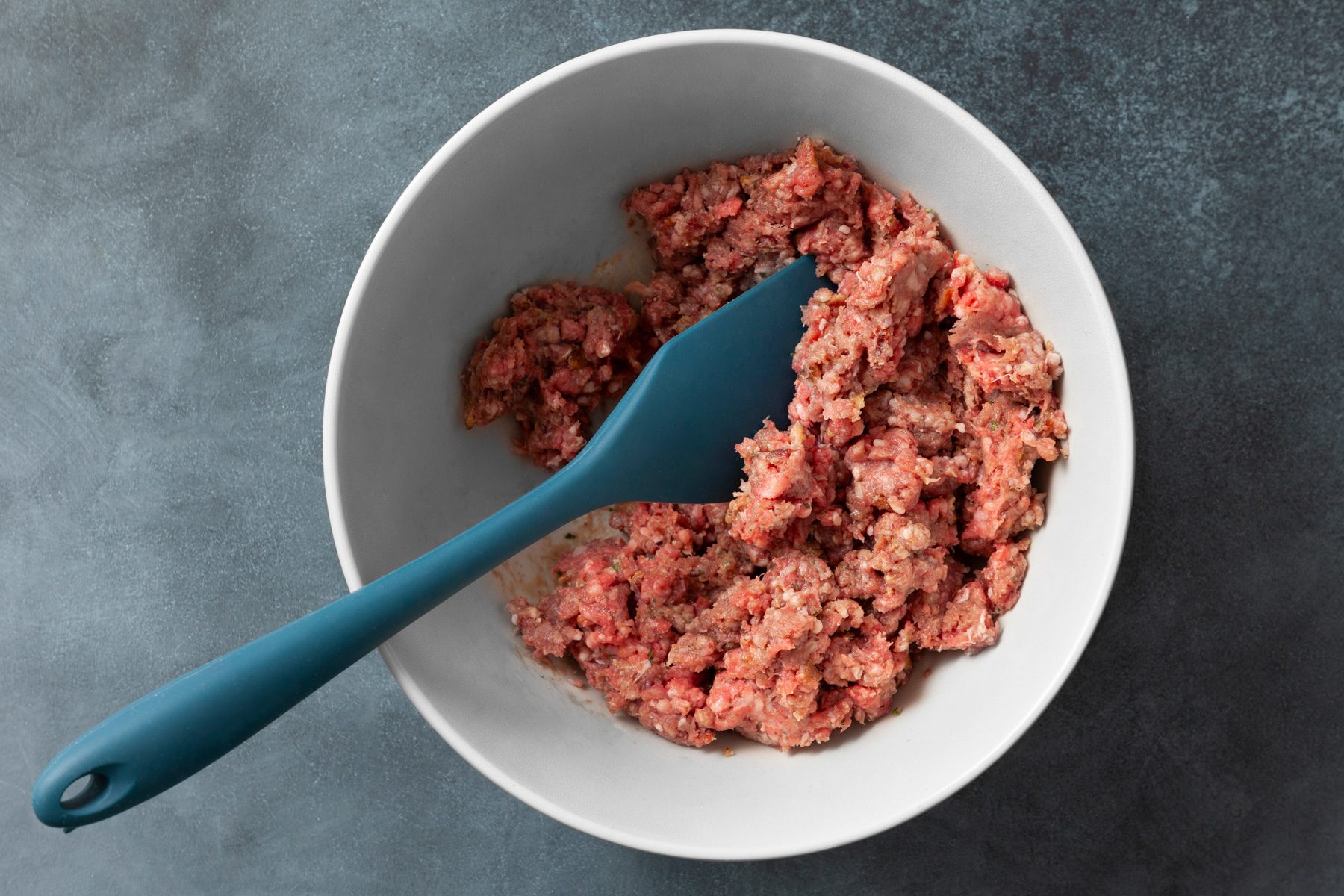 prepared beef mixture in a large white bowl