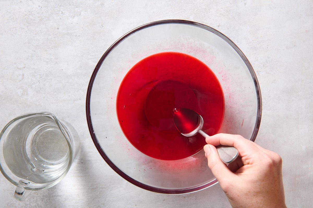 Preparing the top cherry jello layer