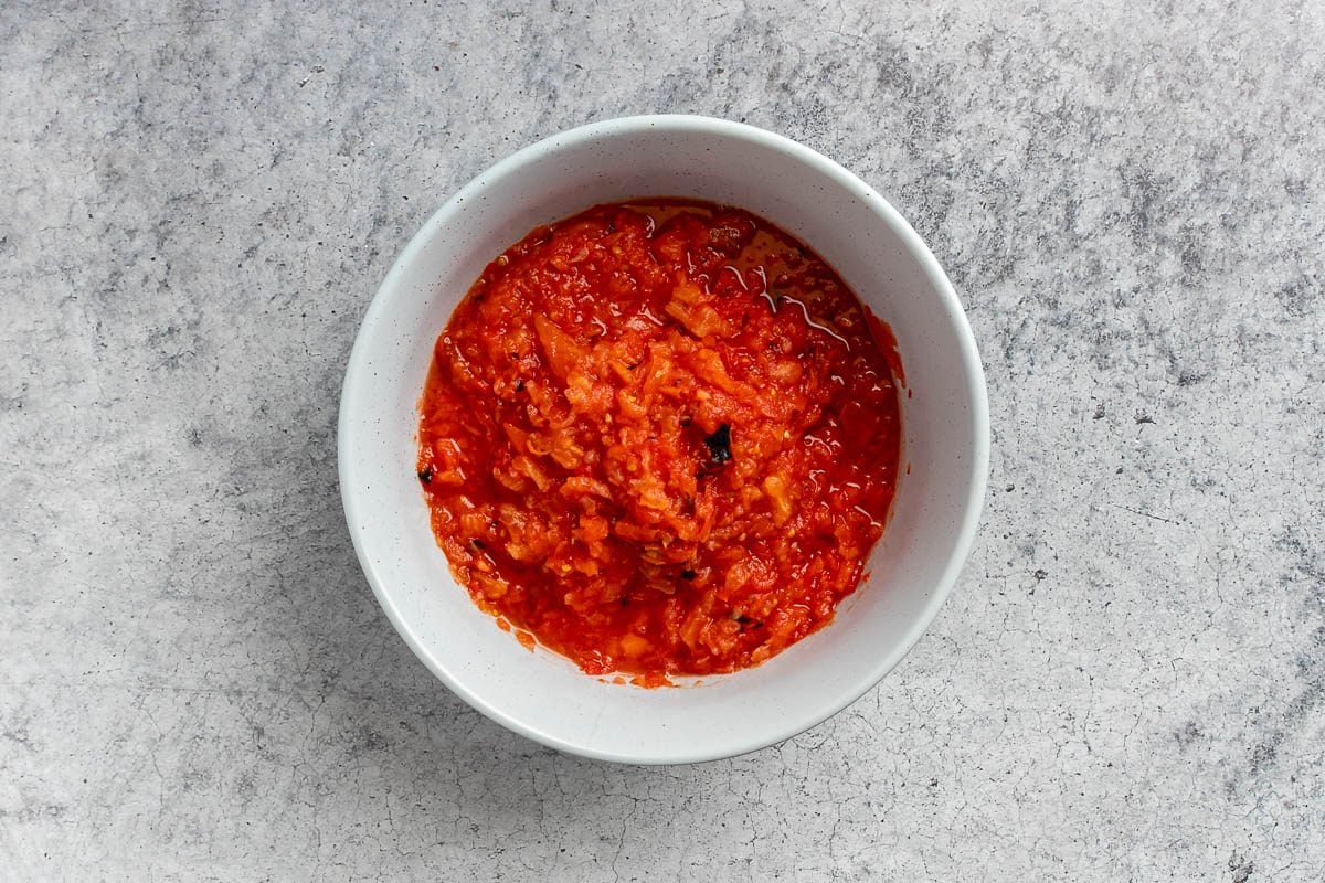 Taste of Home Roasted Salsa Recipe photo of all the tomatoes processed and in a large bowl.