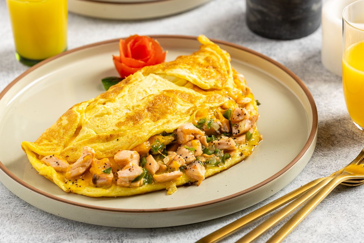 Taste of Home Salmon Omelet recipe photo of the finished omelet served on a plate.