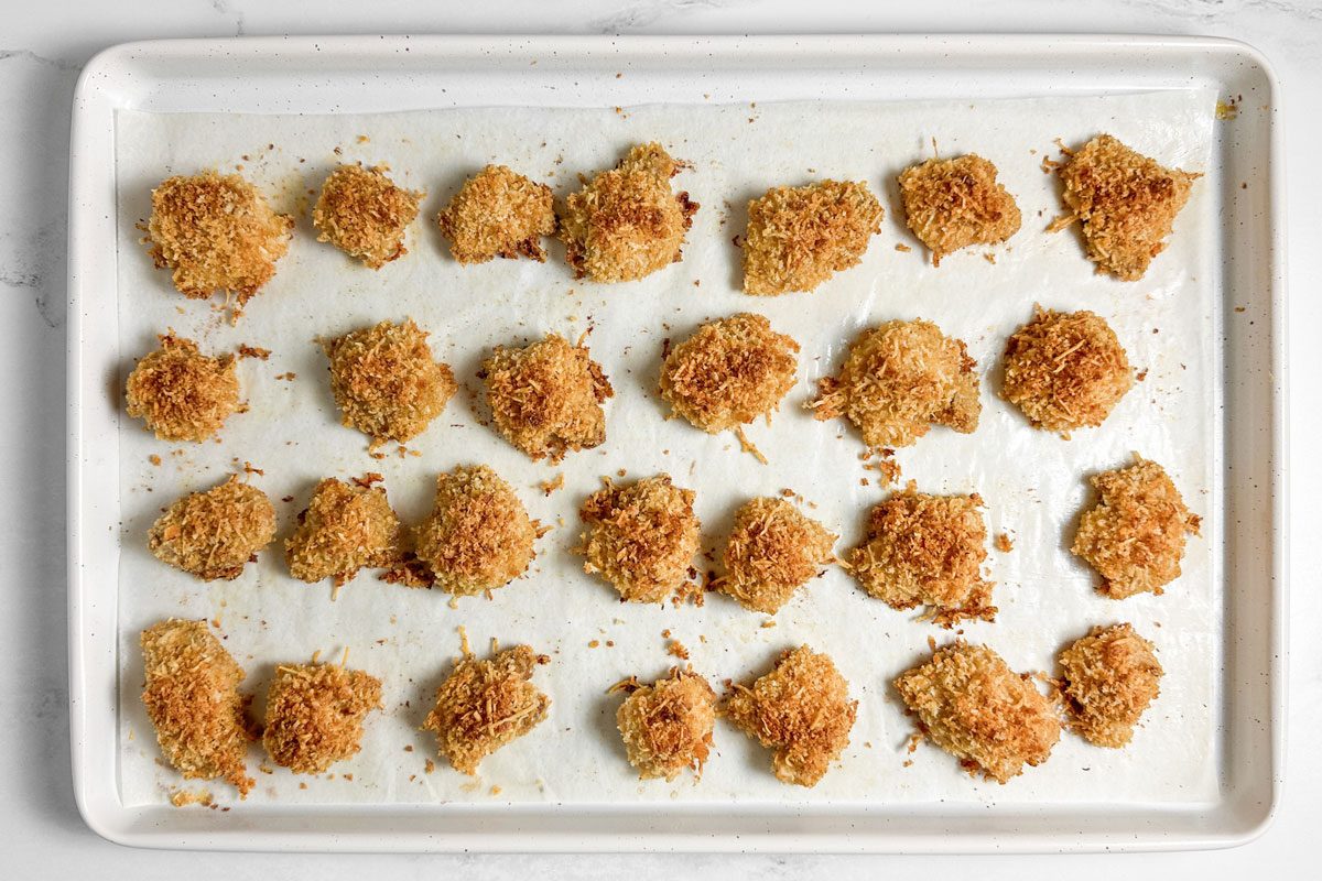 Taste of Home Spicy Chicken Nuggets on a white baking sheet