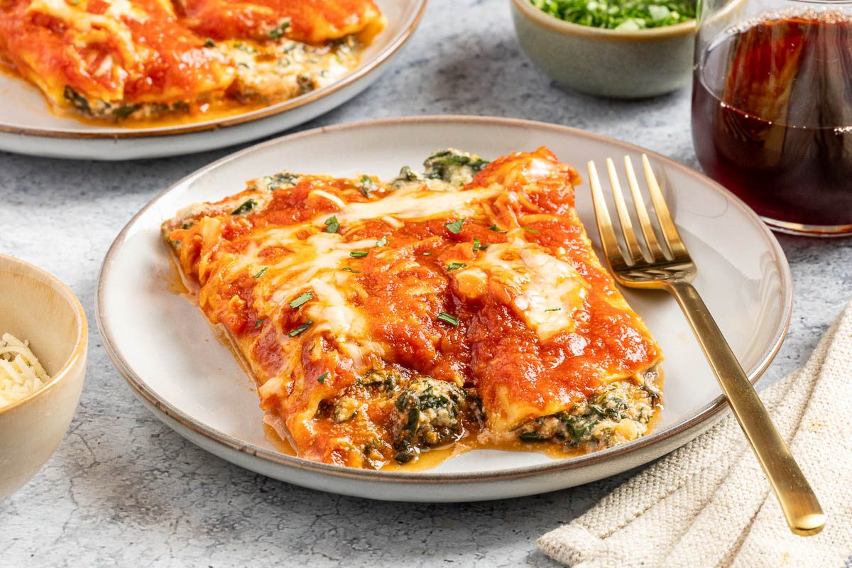 Taste of Home Spinach Manicotti recipe photo of the finished recipe portioned onto plates.