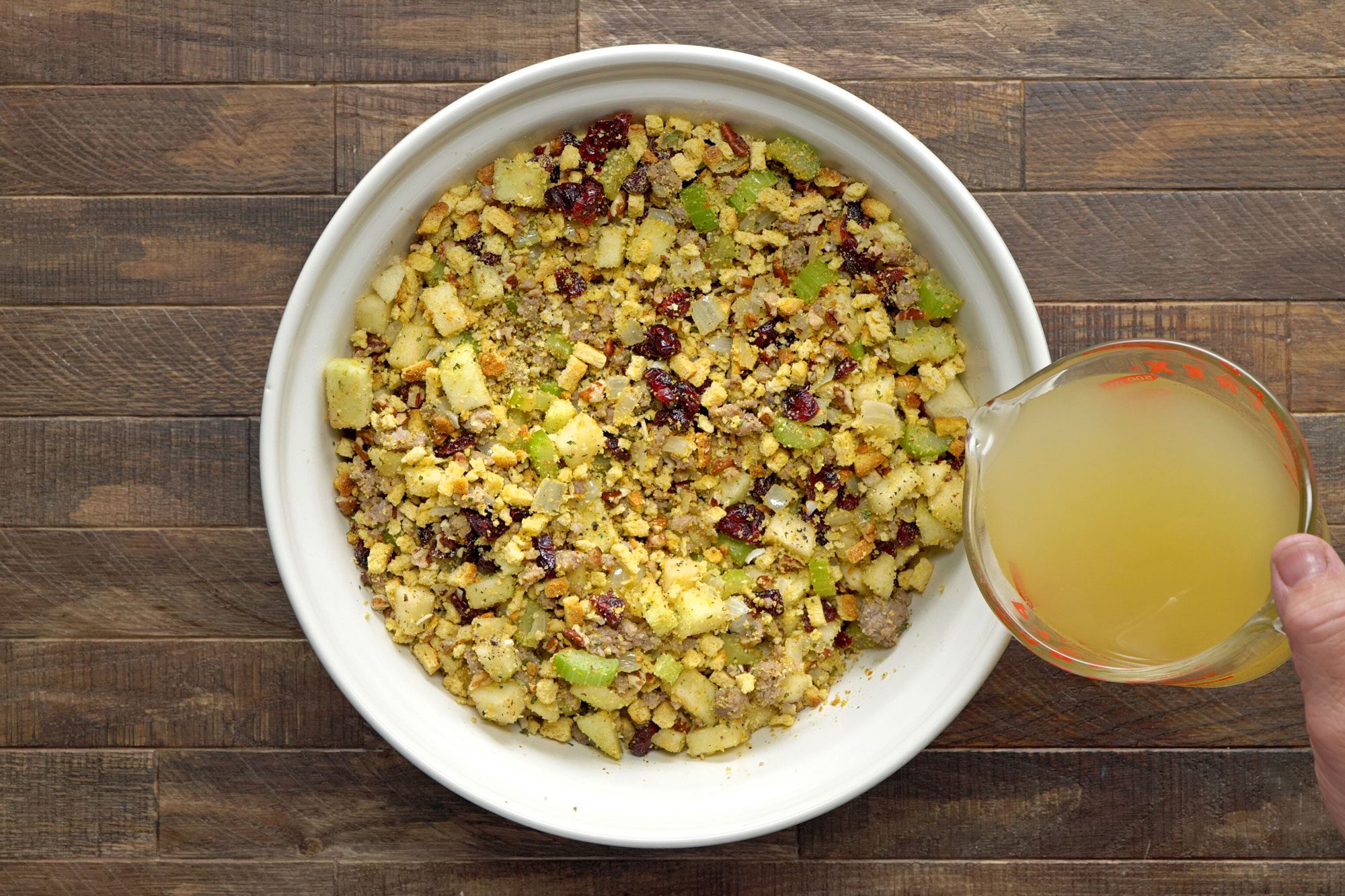 Stir in enough broth to reach desired moistness; Wooden Background;