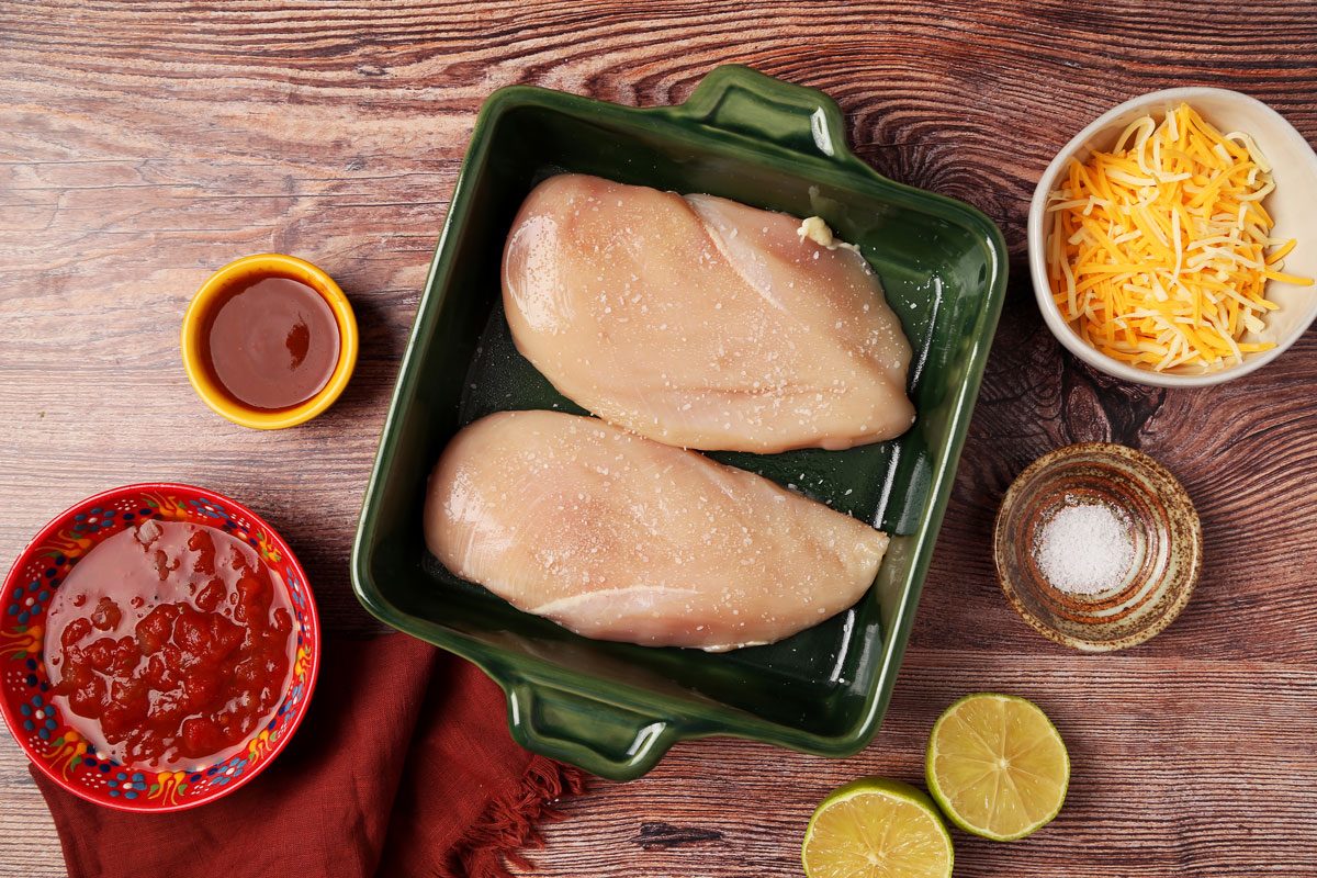 Process of making Taste of Home's Salsa Chicken in a green baking dish on a wooden surface.