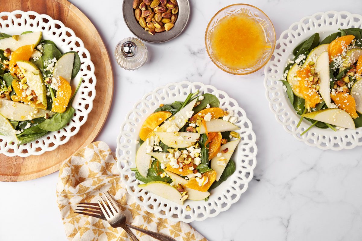 Close up of Taste of Home's Pear Salad on a white marble surface with a yellow linen.