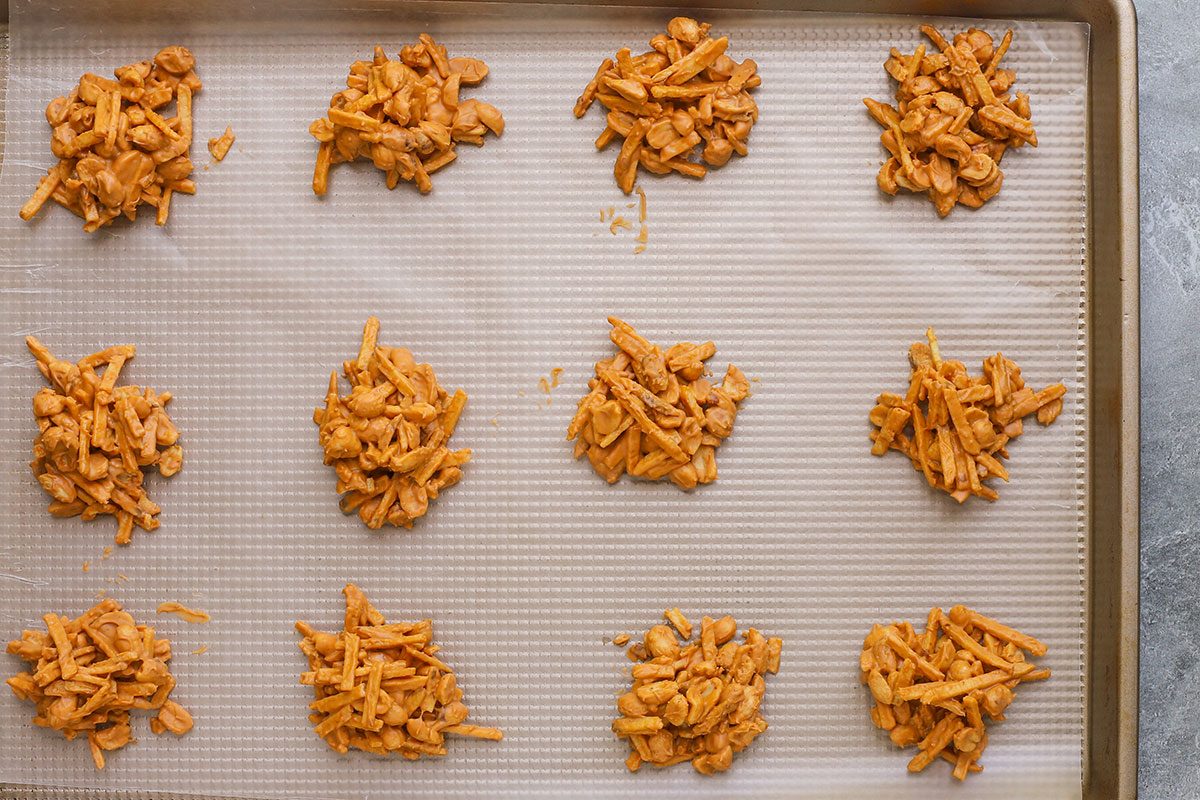 Tumbleweed dessert treats drying on a wax paper-lined baking sheet.