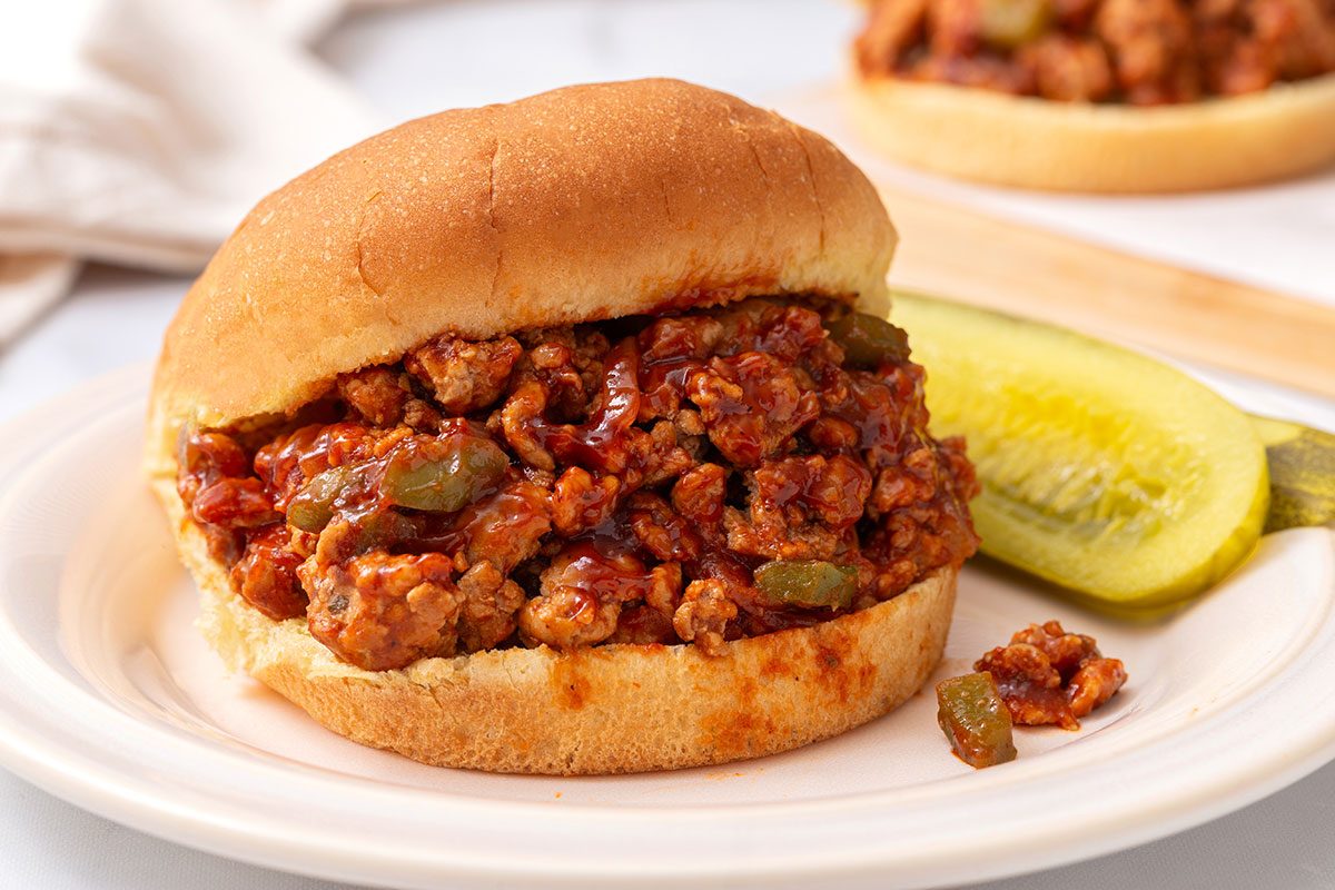 Turkey Sloppy Joe served on a plate with a slice of pickle