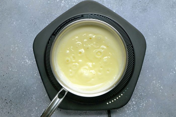 Milk, cornstarch and eggs mixture added to milk.