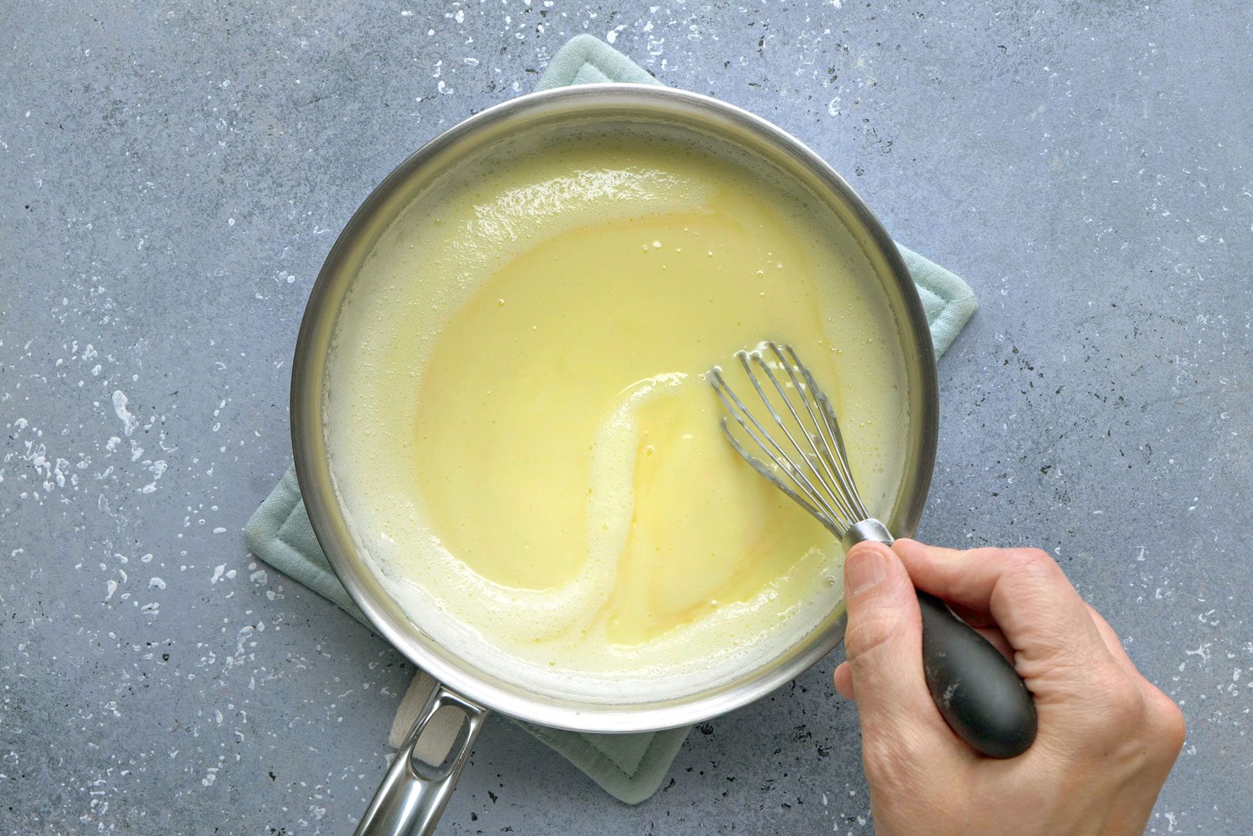 Vanilla and butter stirred in with the cornstarch mixture in boiled milk.