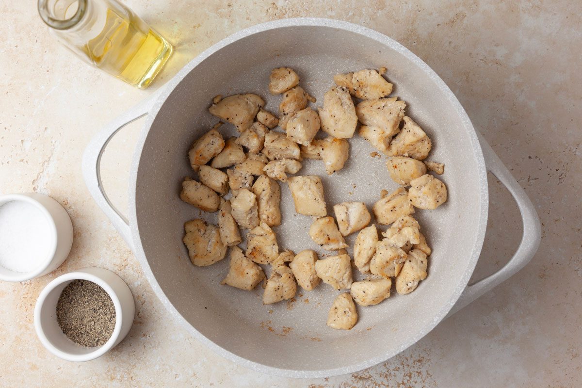 Step 1 of Taste of Home West African Chicken Stew is to season the chicken generously with salt and pepper. In a Dutch oven, cook the chicken over medium heat, in 2 teaspoons of the oil, for four to six minutes or until it’s no longer pink. Remove the chicken from the pot and set it aside.