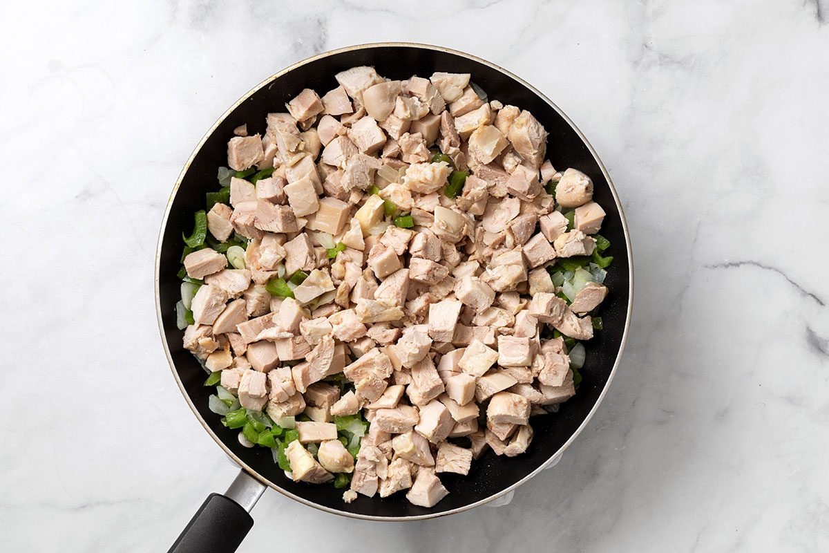 Chicken, onion, green pepper and jalapeño mixture in large skillet