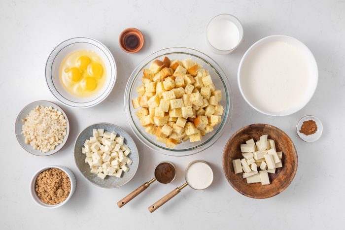 Ingredients for white chocolate bread pudding on kitchen counter.