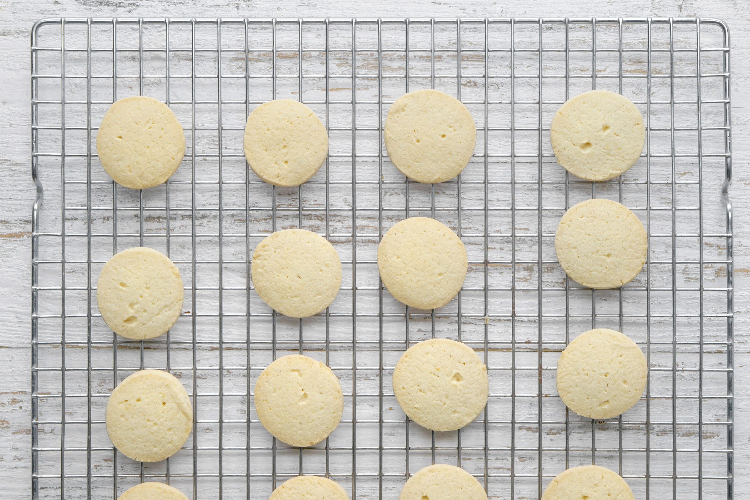 Alfajores cookies on a wire rack