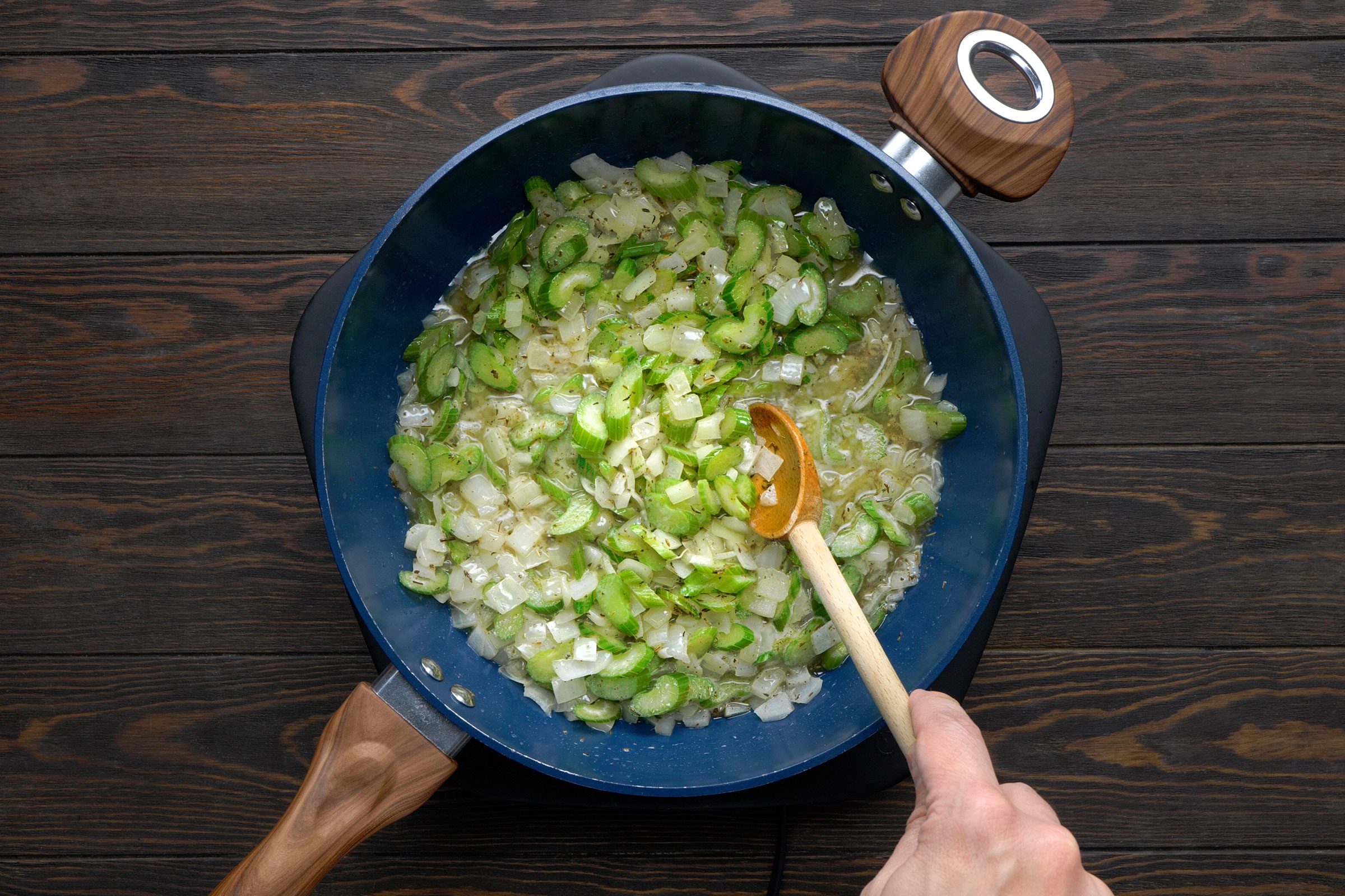 Saute celery, onions, sage and thyme in butter in a large skillet