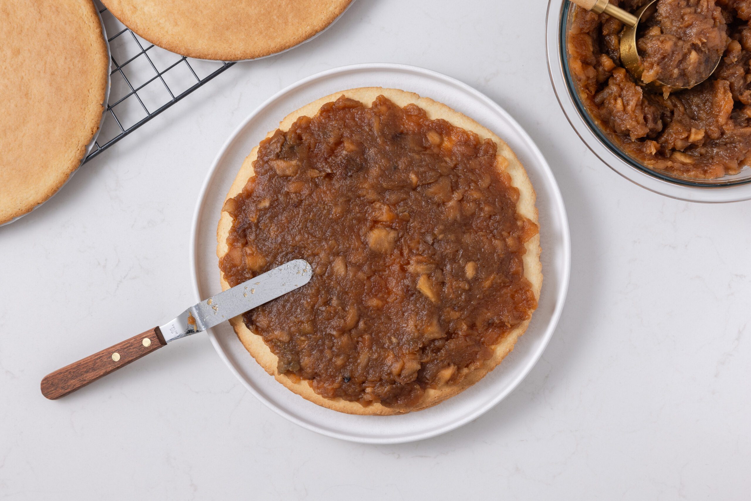 Apple stack cake being assembled.